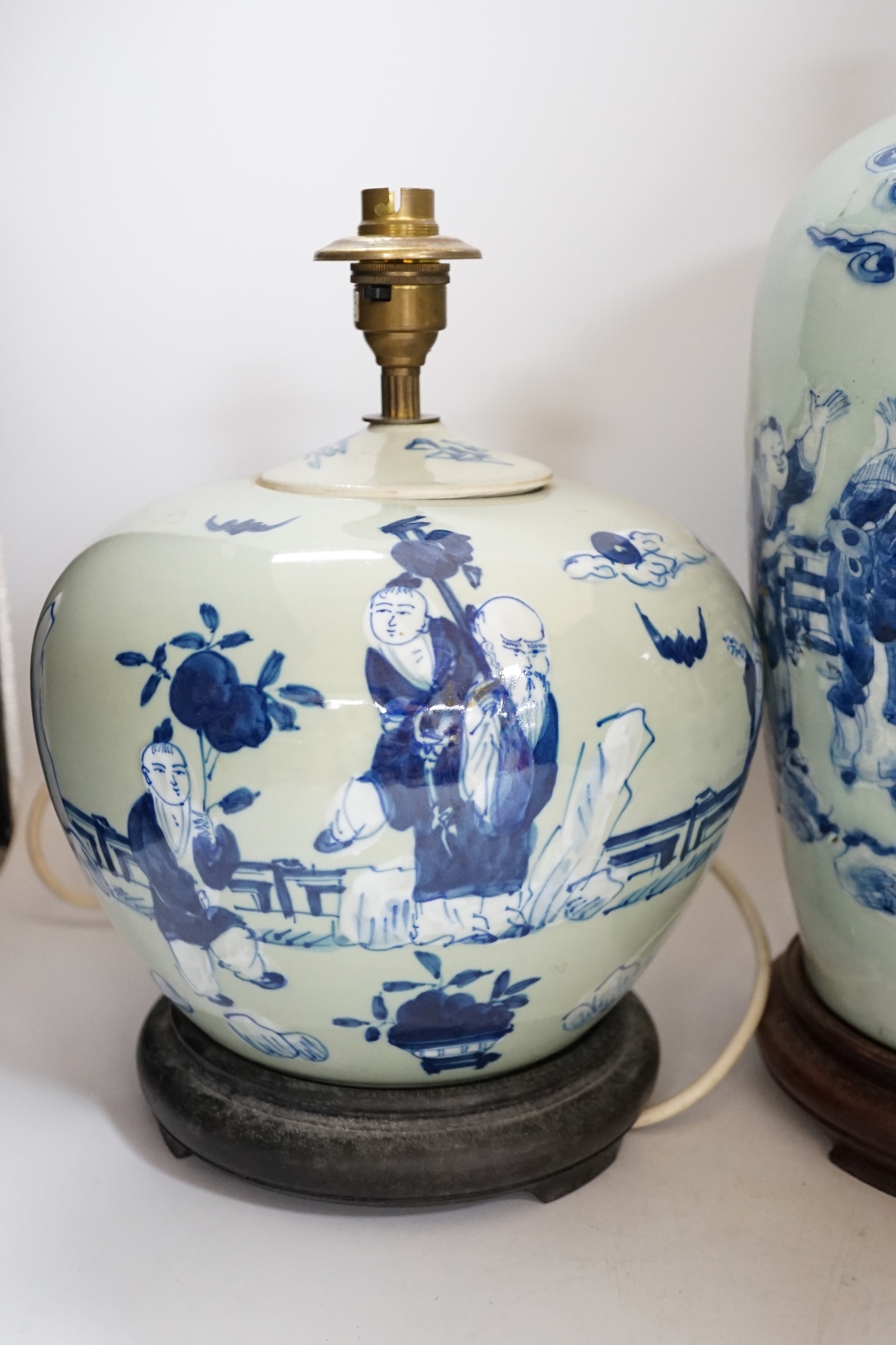 Two Chinese blue and white celadon glazed lamp bases, largest 43cm high including fitting